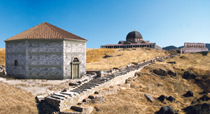  Massimo Limoncelli’s reconstruction of the shrine complex shown in the medallion to the right : the externally octagonal chapel for ablutions is seen on the left beside the processional staircase leading to the top of the hill with the Martyrion on the left and the church of St Philip on the right 
